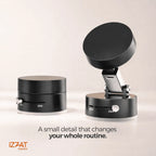 Side-by-side product shot of the Tazzi MagnaFold Phone Mount in two states: left folded compact position and right fully extended upright position — caption reads 'A small detail that changes your whole routine' with IZZAT Express logo