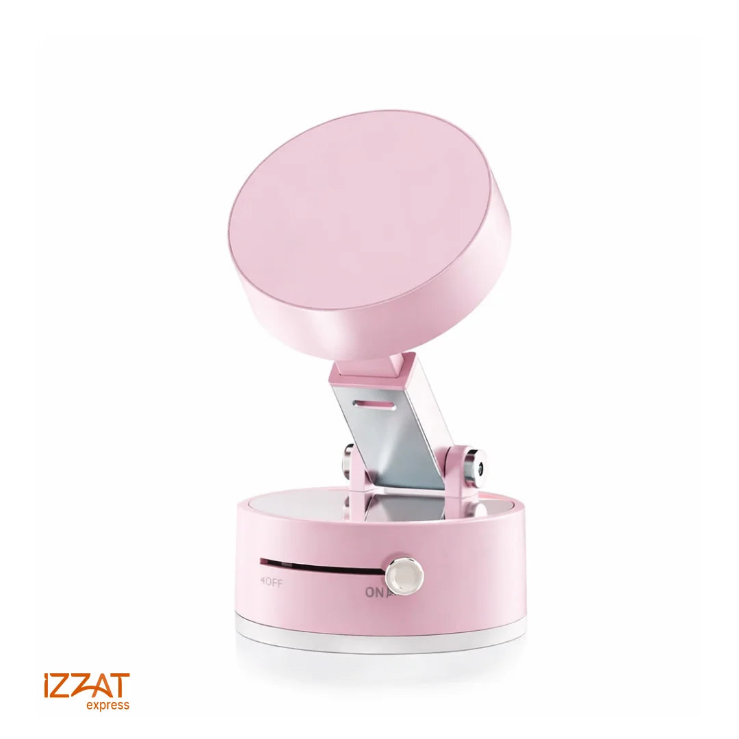 Tazzi MagnaFold Phone Mount in pastel pink colorway — clean white background product shot showing the round magnetic head fully extended on its articulating arm and cylindrical suction base with ON/OFF switch