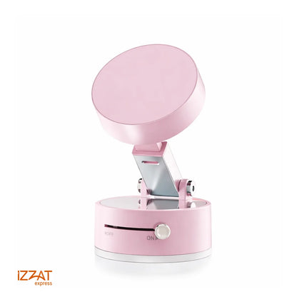 Tazzi MagnaFold Phone Mount in pastel pink colorway — clean white background product shot showing the round magnetic head fully extended on its articulating arm and cylindrical suction base with ON/OFF switch
